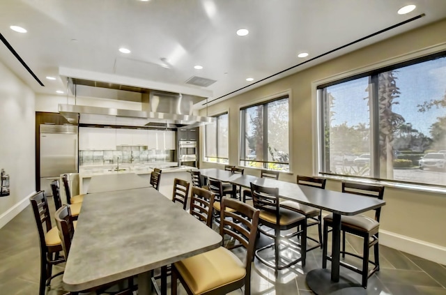 dining room with tile patterned flooring