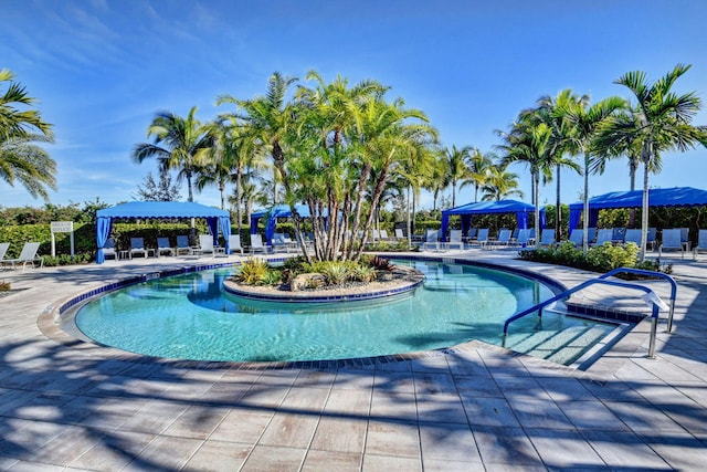 view of pool featuring a gazebo, a patio area, and a mountain view