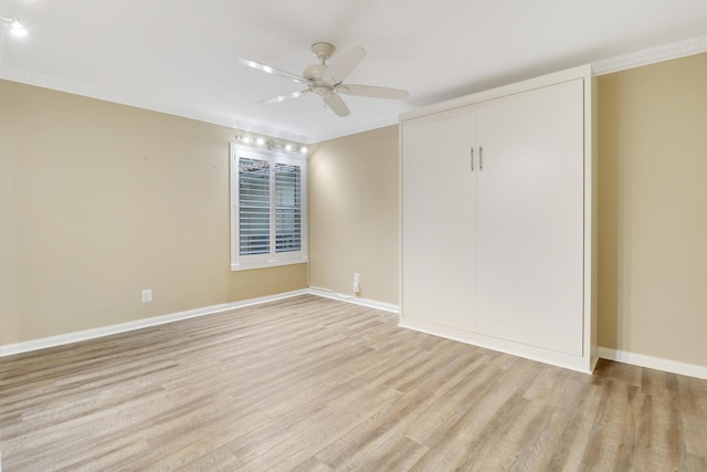 unfurnished bedroom with ceiling fan, a closet, and light wood-type flooring