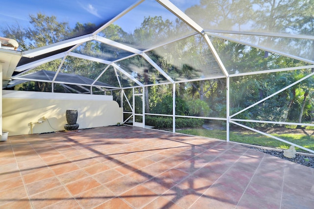 view of patio / terrace featuring a lanai