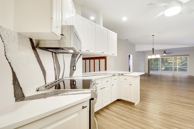 kitchen with ceiling fan, stainless steel appliances, light hardwood / wood-style flooring, kitchen peninsula, and white cabinets