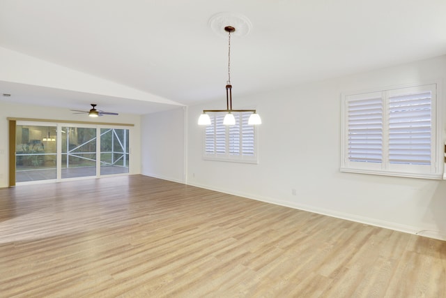 unfurnished room with ceiling fan, lofted ceiling, and light hardwood / wood-style flooring