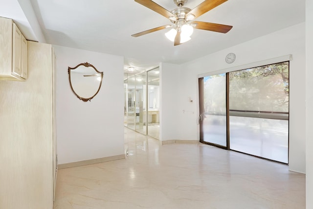 unfurnished room with ceiling fan