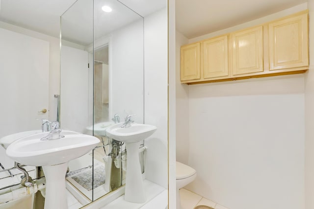 bathroom with tile patterned flooring and toilet