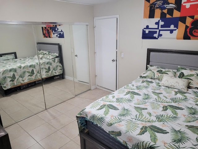 tiled bedroom with a closet