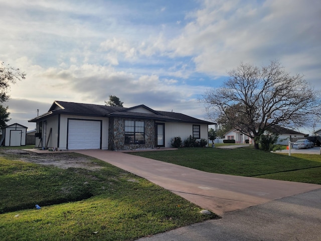 view of front of house featuring a garage and a front lawn