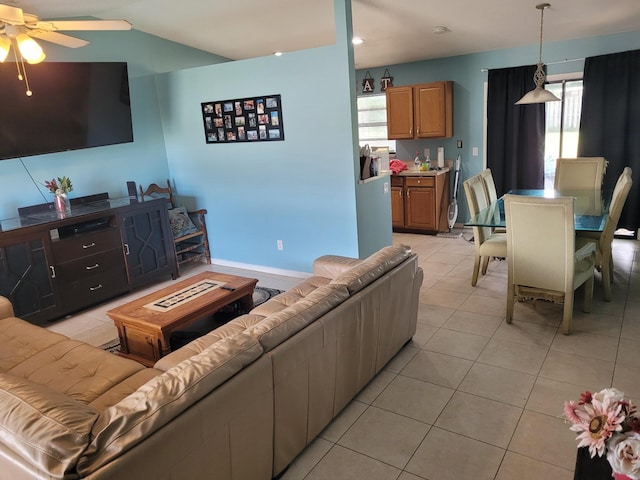 tiled living room with ceiling fan