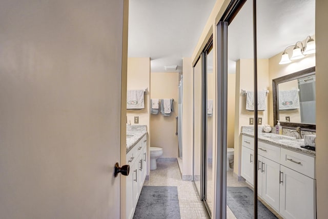 full bathroom featuring toilet and vanity