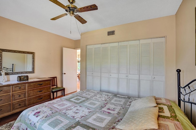 bedroom with ceiling fan and a closet