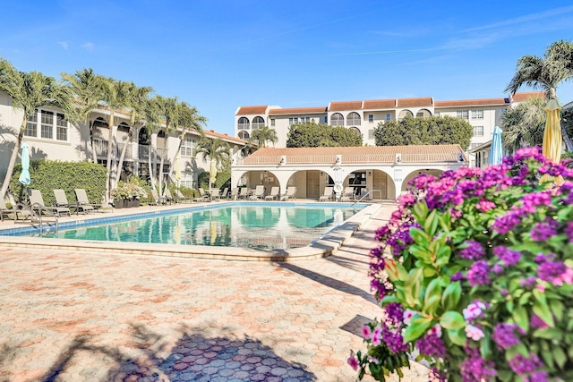 community pool with a patio area