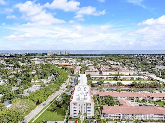 drone / aerial view featuring a view of city and a water view