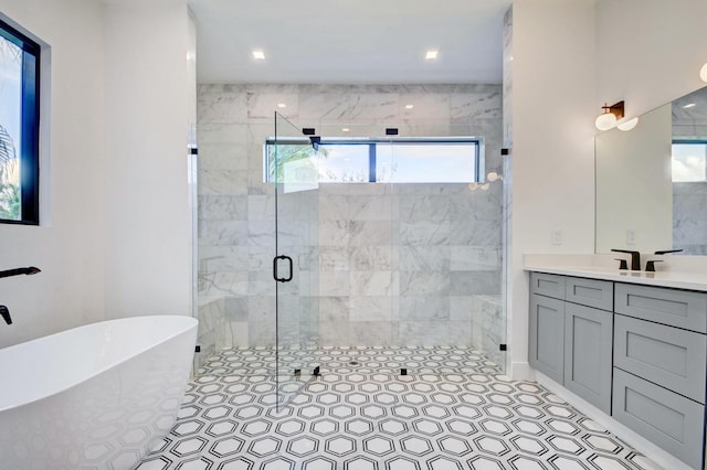 bathroom featuring vanity, tile patterned flooring, and independent shower and bath