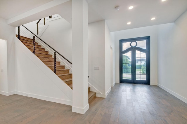 entrance foyer with hardwood / wood-style floors and french doors