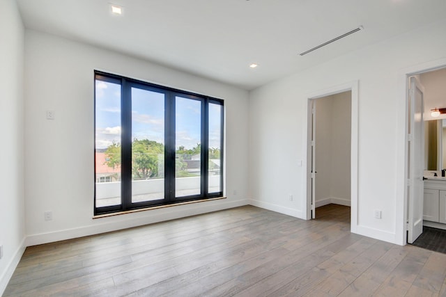 empty room with light wood-type flooring