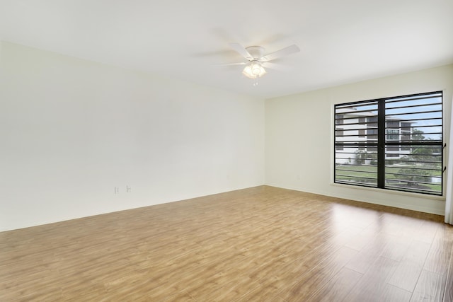 empty room featuring ceiling fan and light wood-type flooring