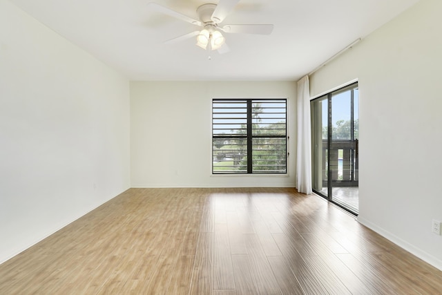 empty room featuring ceiling fan and light wood-type flooring