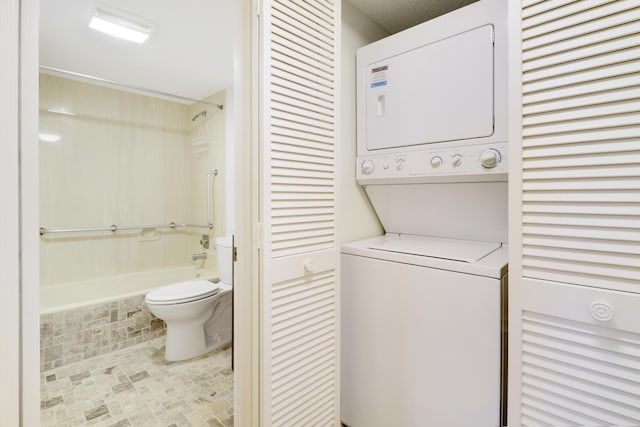 laundry area featuring stacked washer and clothes dryer