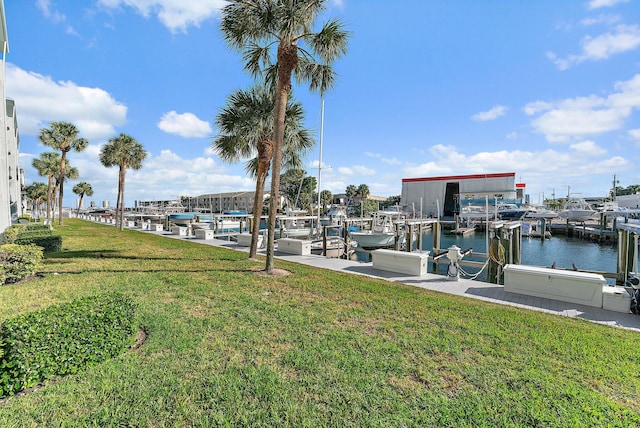 view of dock featuring a yard and a water view