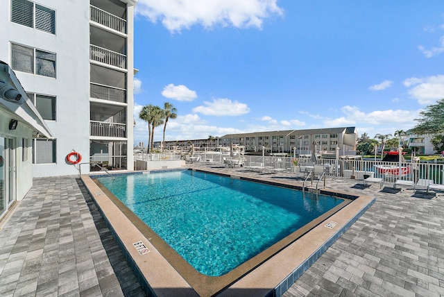 view of pool featuring a patio area