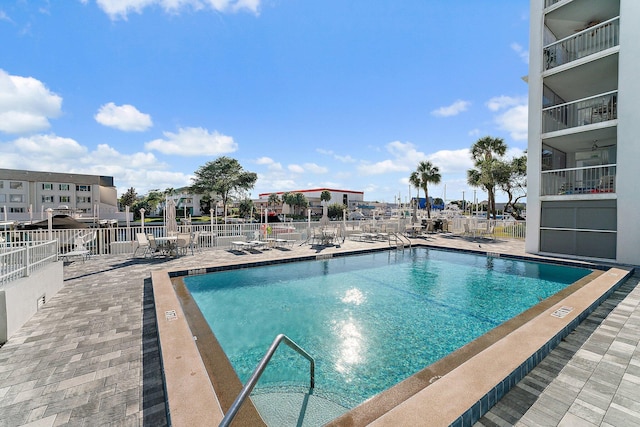 view of swimming pool with a patio