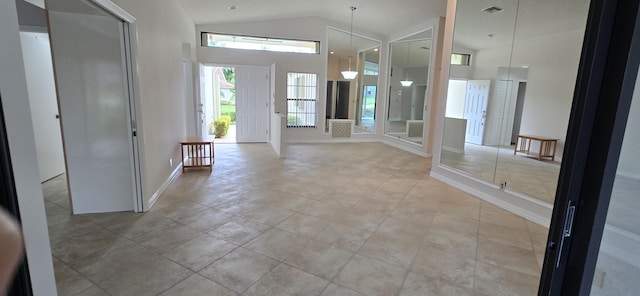 tiled foyer entrance with lofted ceiling