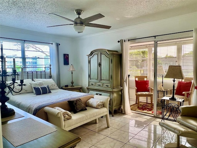 tiled bedroom with multiple windows, a textured ceiling, and ceiling fan