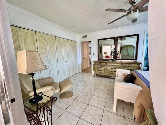 sitting room featuring light tile patterned floors, a textured ceiling, ceiling fan, and crown molding