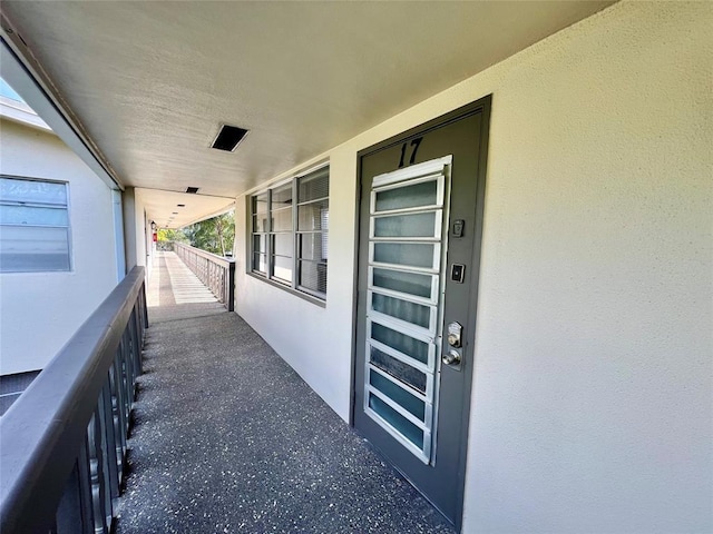 entrance to property featuring a balcony