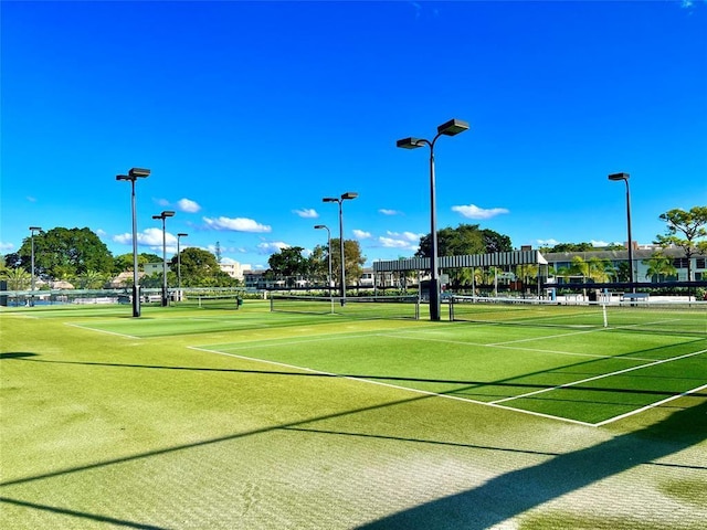 surrounding community featuring tennis court