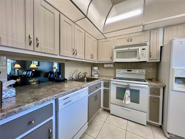 kitchen with tasteful backsplash, white appliances, sink, light brown cabinets, and light tile patterned flooring