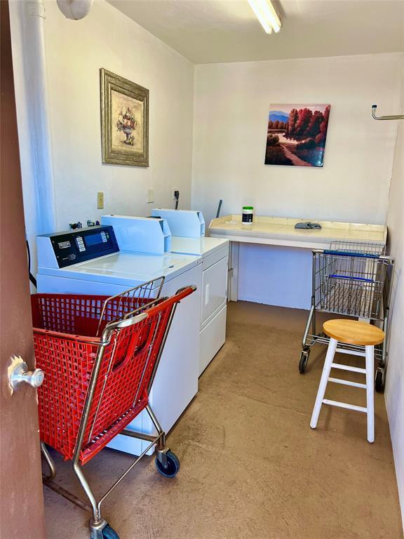 laundry room featuring washer and clothes dryer