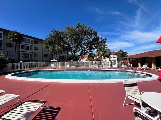 view of swimming pool featuring a patio area