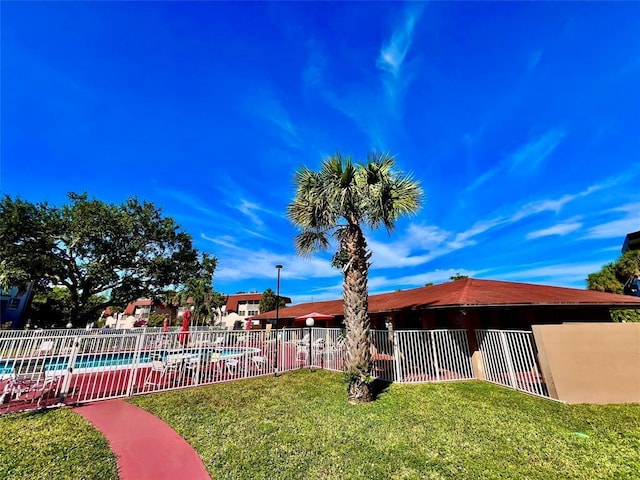 view of yard featuring a community pool