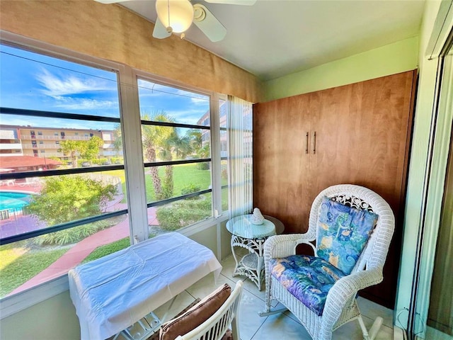 sunroom / solarium with ceiling fan