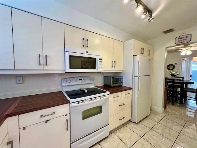 kitchen with white cabinetry, ceiling fan, and white appliances