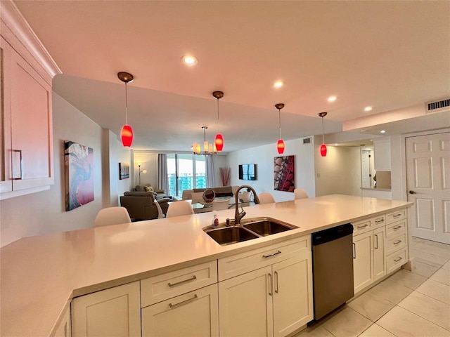 kitchen with light tile patterned floors, decorative light fixtures, stainless steel dishwasher, and sink