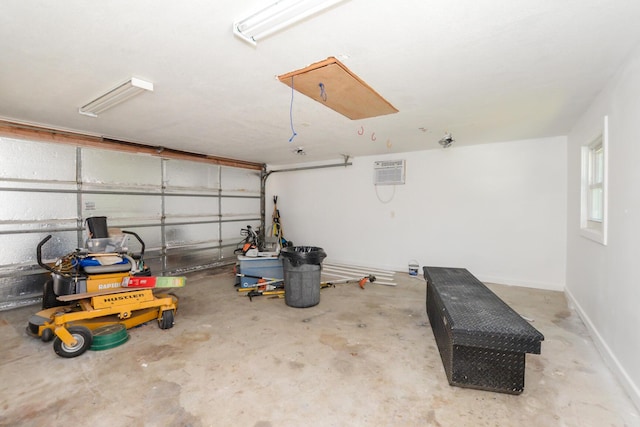 garage featuring a wall mounted AC