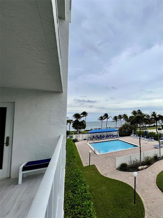 view of pool featuring a water view