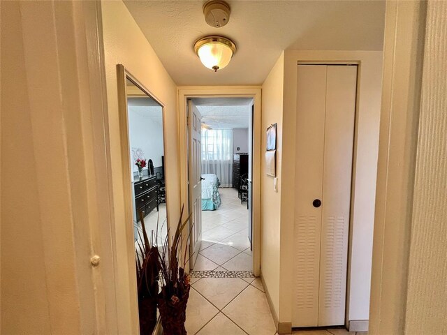 spacious closet featuring light tile patterned floors