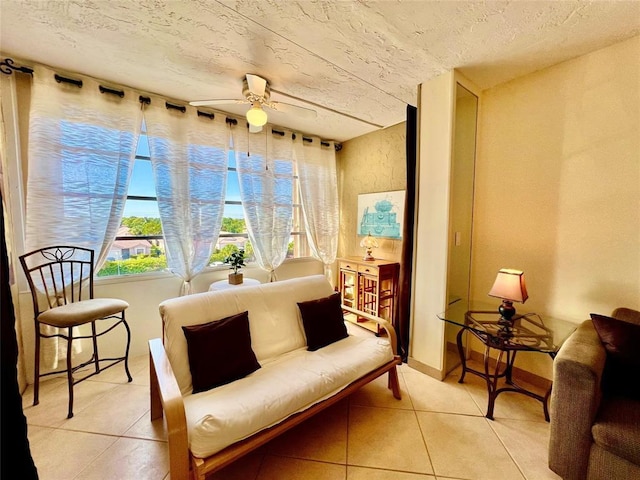 interior space featuring light tile patterned floors and ceiling fan