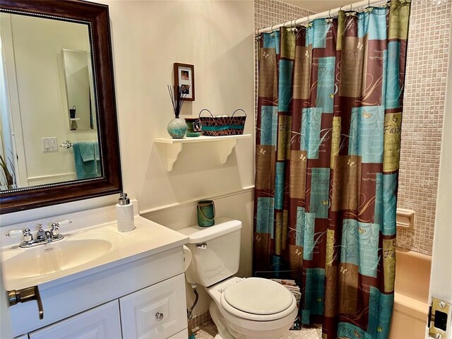 laundry room with light tile patterned flooring and a textured ceiling