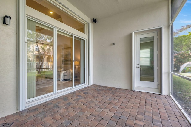 unfurnished sunroom with a healthy amount of sunlight