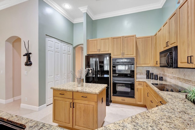 kitchen with backsplash, black appliances, crown molding, light stone countertops, and light brown cabinets