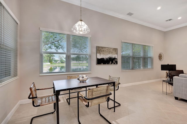 tiled dining area with a notable chandelier and ornamental molding