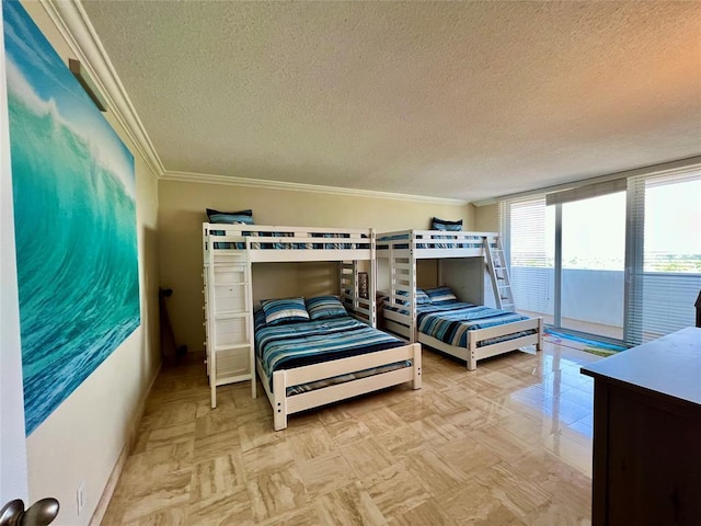 bedroom with a textured ceiling, access to outside, and crown molding