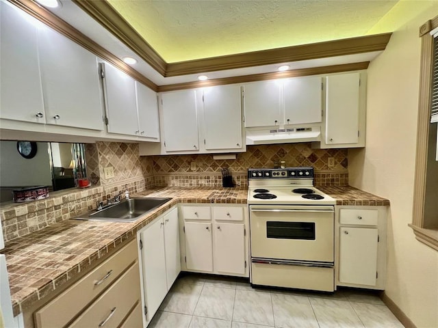 kitchen featuring white range with electric cooktop, backsplash, white cabinets, and sink