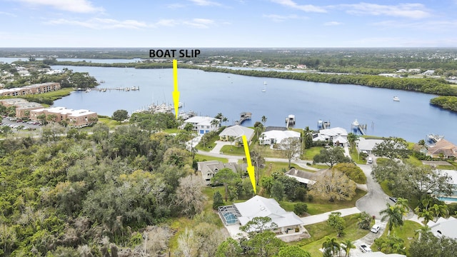 birds eye view of property featuring a water view