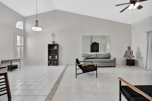 tiled living room with high vaulted ceiling and ceiling fan