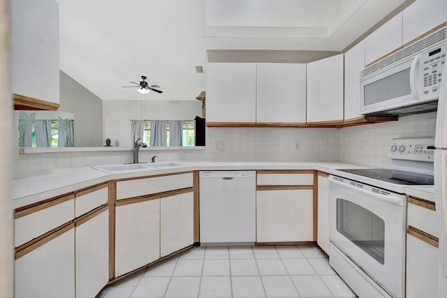 202 Muirfield Ct Unit E, Jupiter, FL 33458 - kitchen featuring white appliances, light countertops, ceiling fan, decorative backsplash, and lofted ceiling
