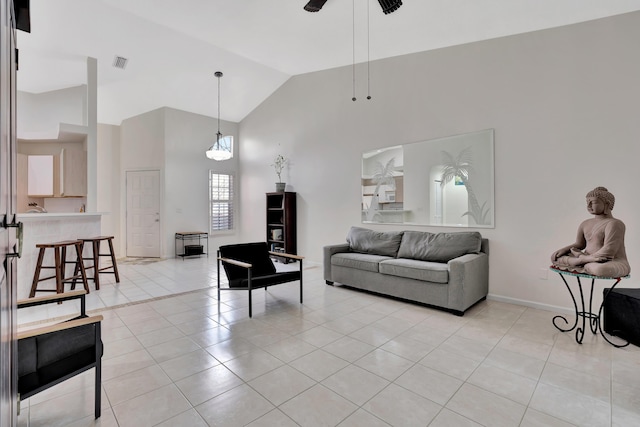 living room with light tile patterned floors, high vaulted ceiling, and ceiling fan